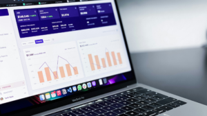 CRM dashboard on laptop showing revenue, subscriptions, and sales performance analytics